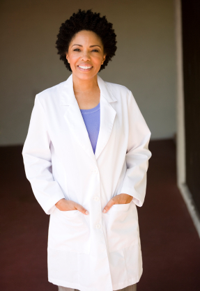 Female oral surgeon in San Juan, CA smiling.
