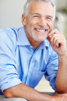 San Juan, CA man smiling after successful bone grafting and dental implant procedures.